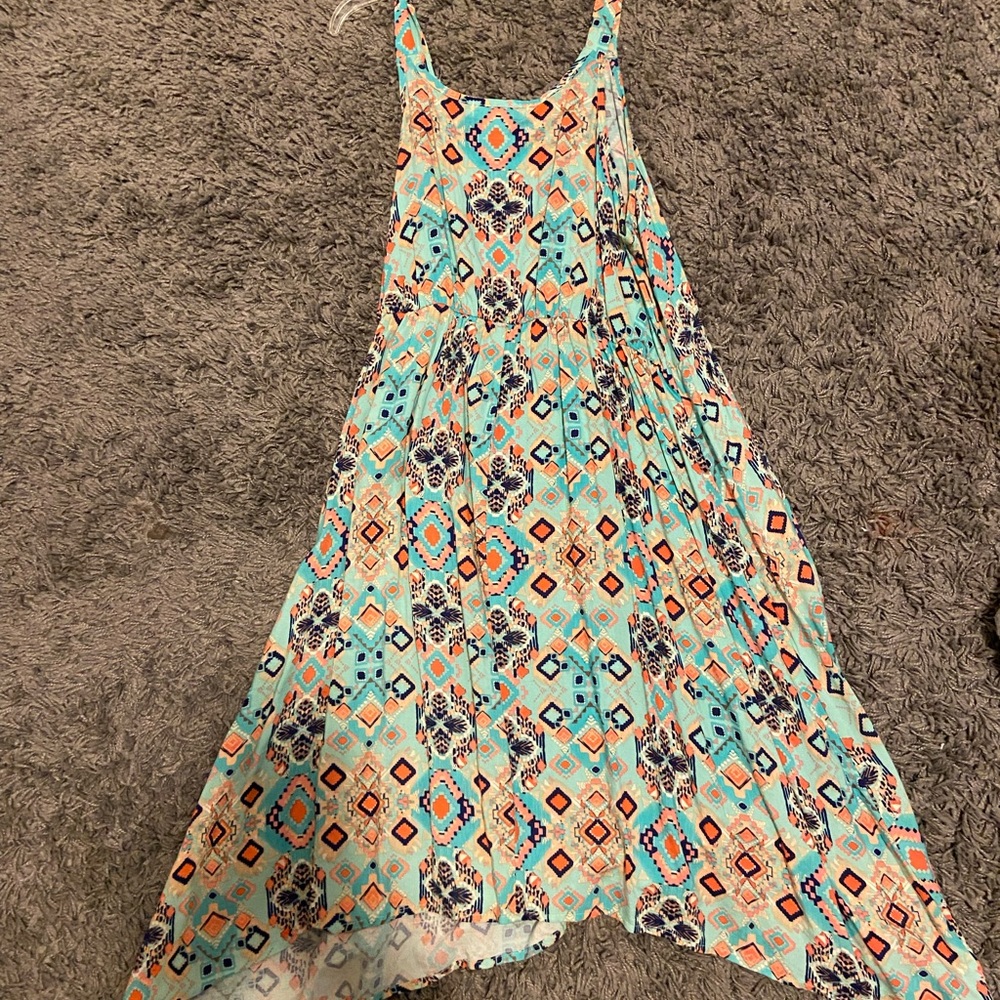 Mid length dress, lots of different pastel colors and flowy.